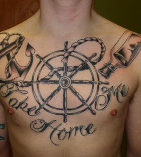 Large wheel chest tattoo