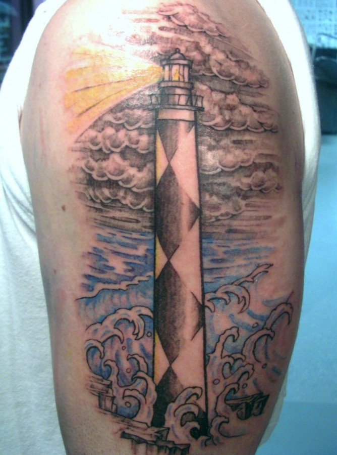 Lighthouse and clouds tattoo