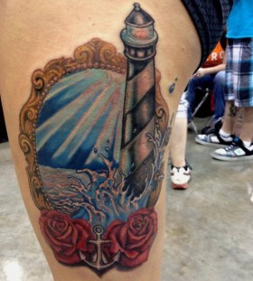 Lighthouse frame and roses tattoo