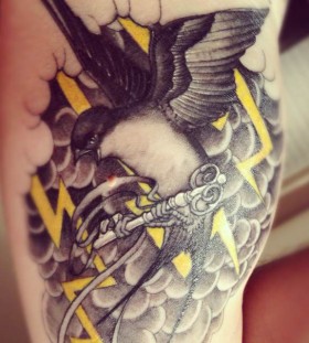 Lightning and bird tattoo