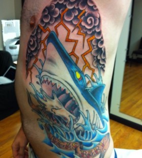 Lightning and shark tattoo