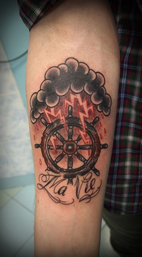 Lightning and wheel tattoo