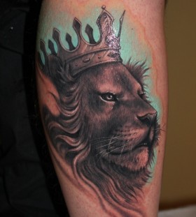 Lion with crown tattoo by Riccardo Cassese