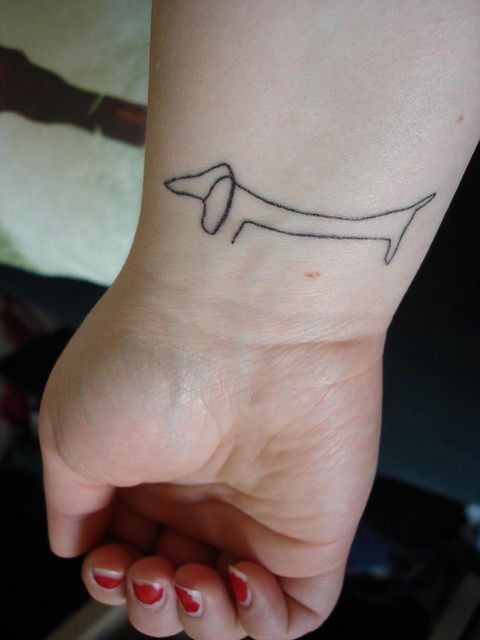Long simple dog’s tattoo