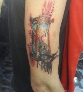 Lovely arm's sand clock tattoo