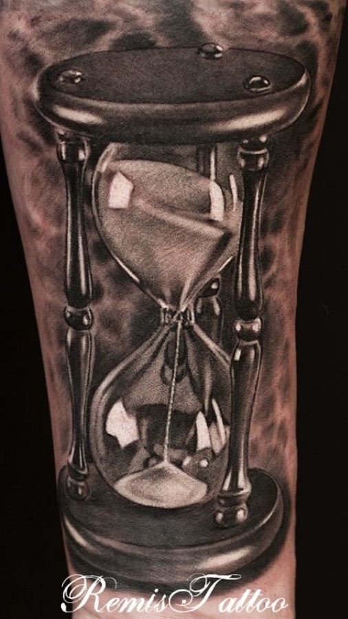 Lovely black and white sun clock tattoo