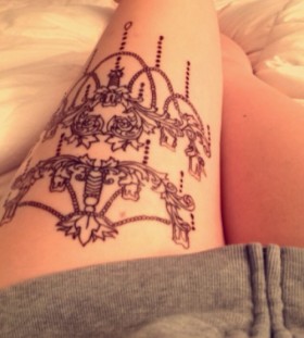 Lovely chandelier leg tattoo