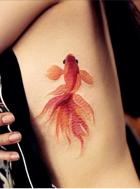 Lovely fish tattoo by Chen Jie