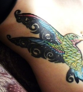 Lovely hummingbird stomach tattoo