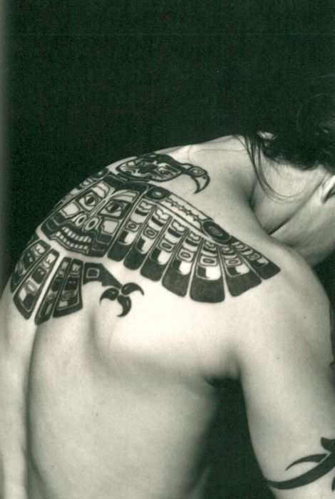 Lovely looking tribal bird tattoo