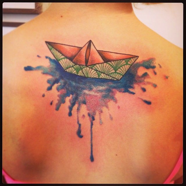 Lovely origami boat back tattoo