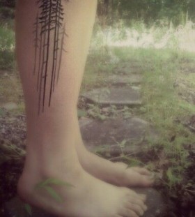 Lovely pine tree leg tattoo