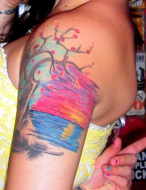 Lovely sunset arm tattoo