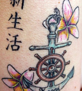 Lovely wheel and anchor tattoo