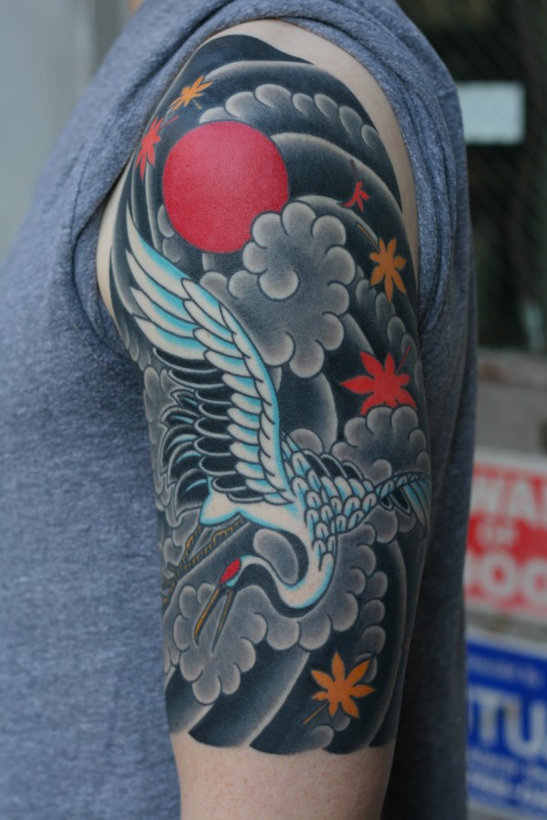 Magnificent crane arm tattoo