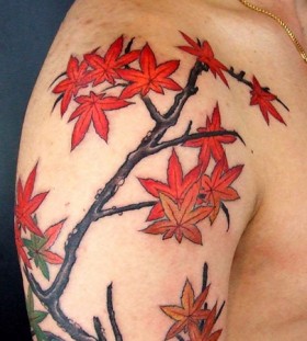 Maple leaves arm tattoo