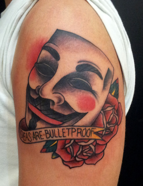 Mask of  V with quote tattoo