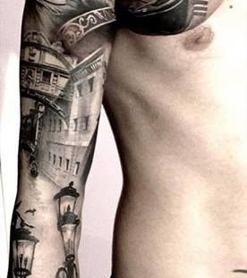 Men's chest town tattoo