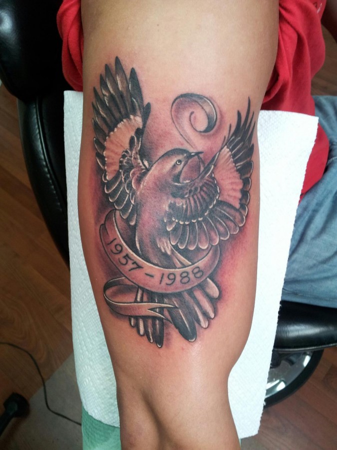 Mockingbird memorial arm tattoo