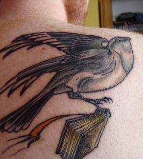 Mockingbird with a book tattoo