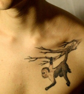 Monkey on a branch tattoo