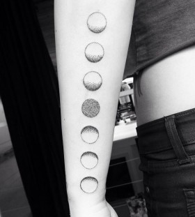 Moon phase arm tattoo