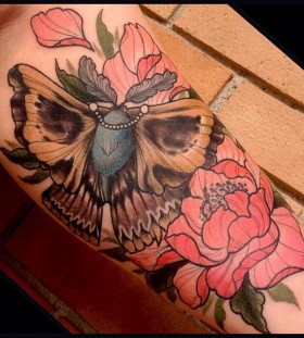 Moth and flowers tattoo