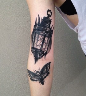 Moth and lantern tattoo