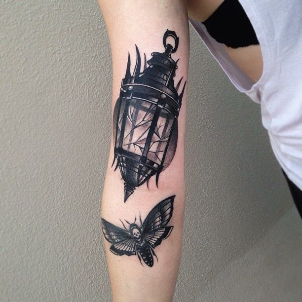 Moth and lantern tattoo