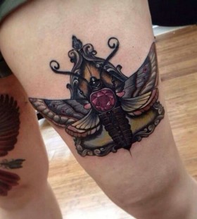 Moth with jewel tattoo