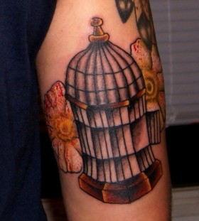 Nice birdcage arm tattoo
