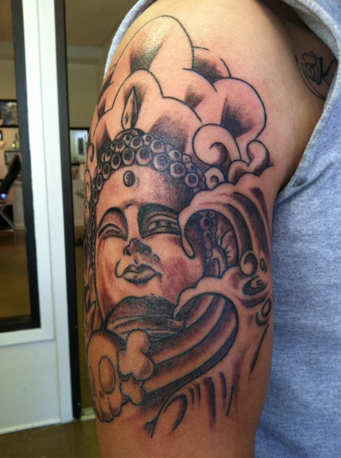 Nice buddha arm tattoo