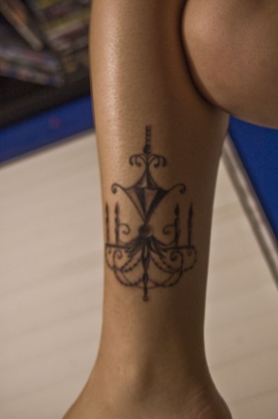 Nice chandelier leg tattoo