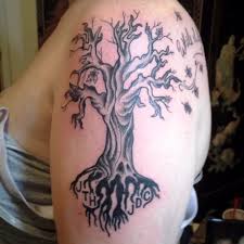 Nice dead tree arm tattoo