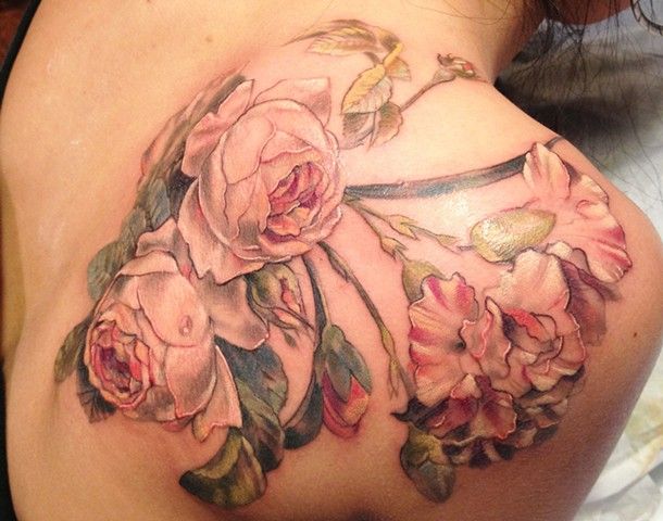 Nice flowers back tattoo by Esther Garcia