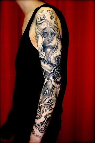 Nice full arm tattoo by Eva Huber