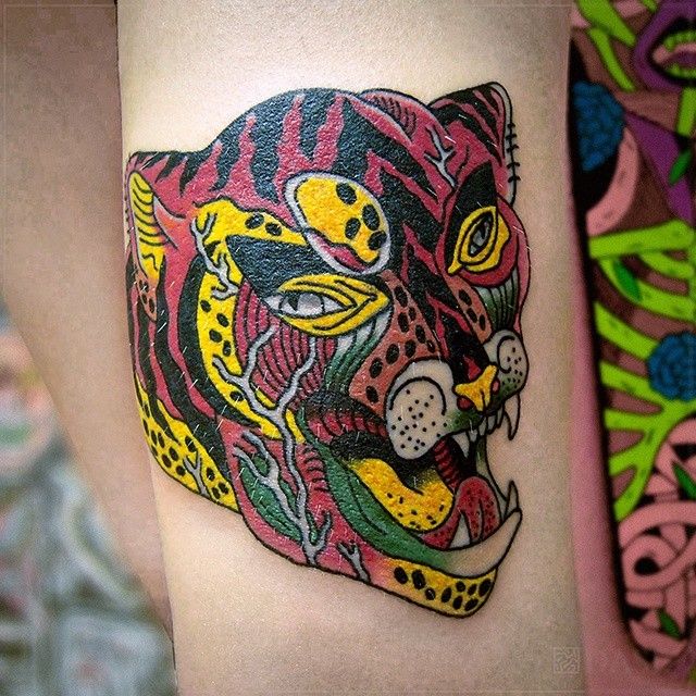 Nice puma tattoo by Dase Roman Sherbakov