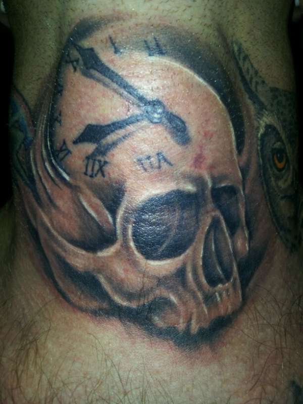 Nice skull clock tattoo