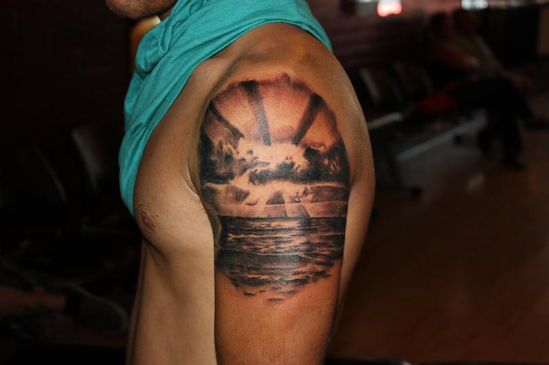 Nice sunset arm tattoo