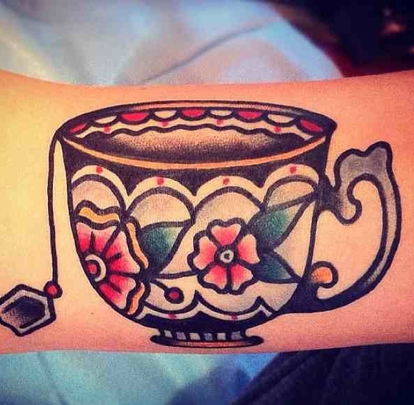 Nice teacup arm tattoo