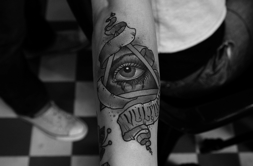Nice triangle eye tattoo