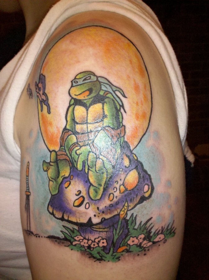 Ninja turtle sitting on mushroom tattoo
