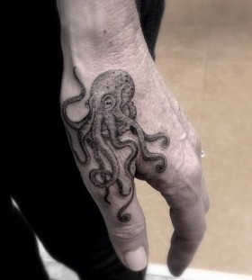 Octopus hand tattoo by Dr Woo