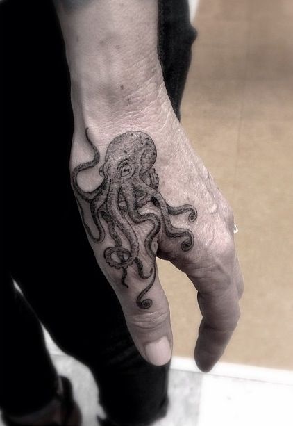 Octopus hand tattoo by Dr Woo