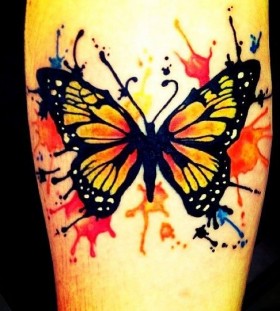 Orange and black watercolor butterfly tattoo