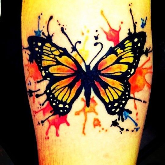 Orange and black watercolor butterfly tattoo