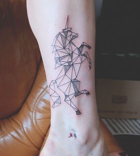 Origami style unicorn tattoo