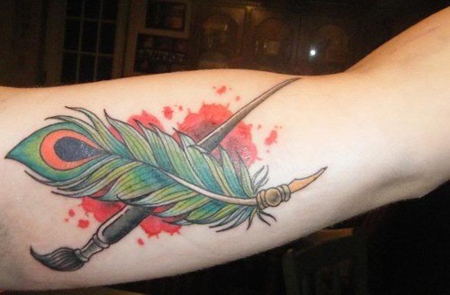 Paint brush and feather tattoo