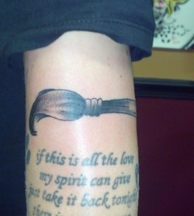 Paint brush and quote tattoo
