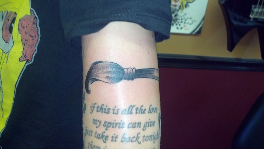 Paint brush and quote tattoo